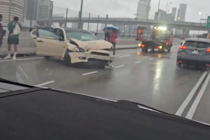 Car Skids on Wet Causeway, Hits Pedestrian